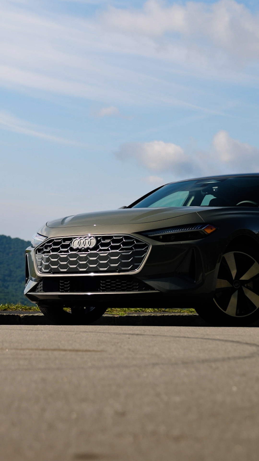 Side view of an Audi vehicle parked.