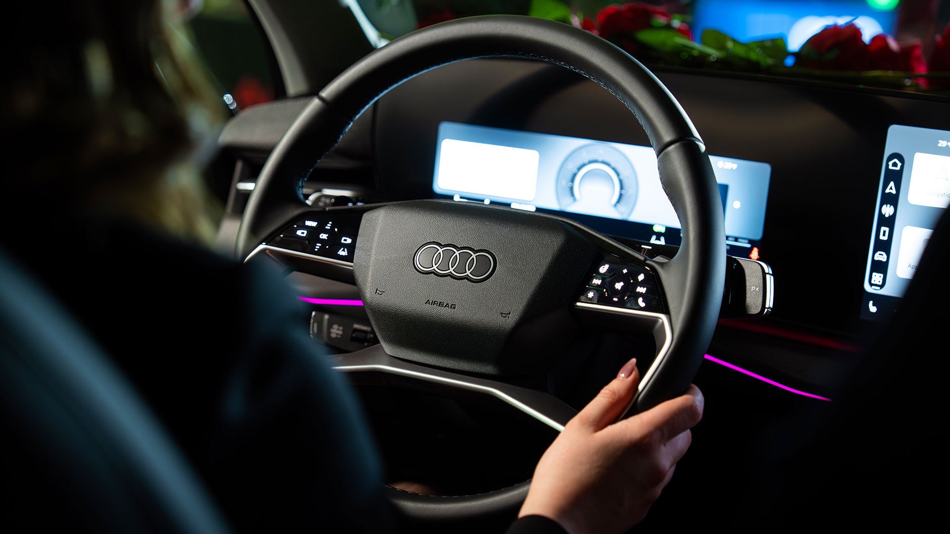 Audi interior with customer behind the wheel