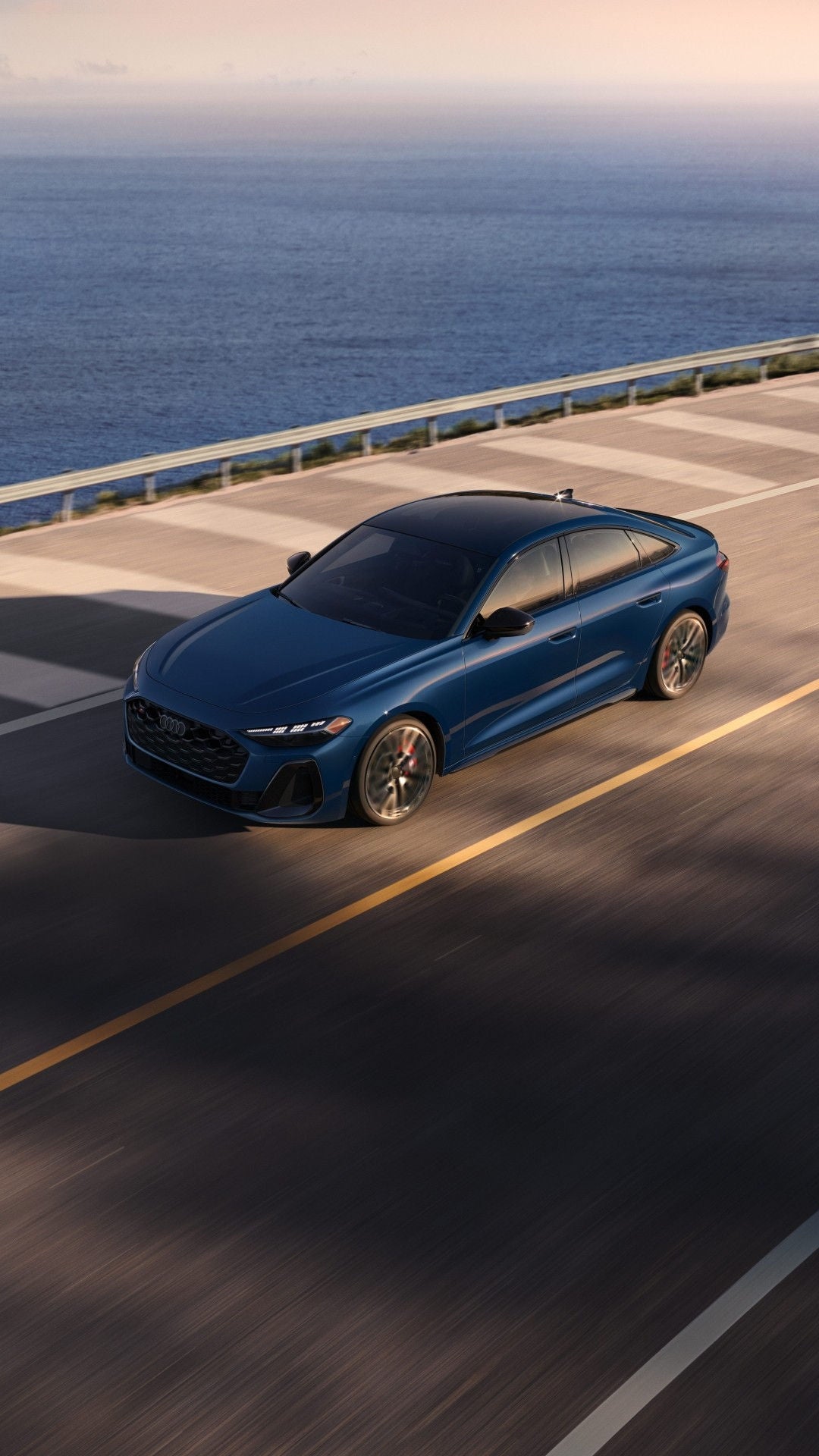 Overhead shot of an Audi S5 driving on a bridge