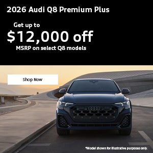 Back view of an Audi Q8 accelerating.