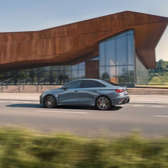 Side view of the Audi RS 3 accelerating.