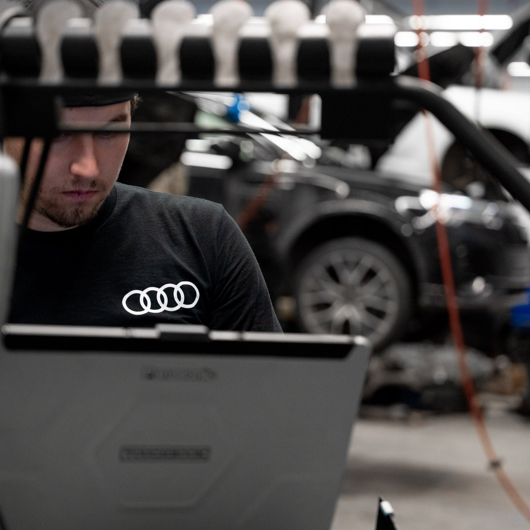 Audi Specialist working on vehicles.