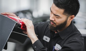 Image of Ivan Balilo working on an Audi vehicle. 