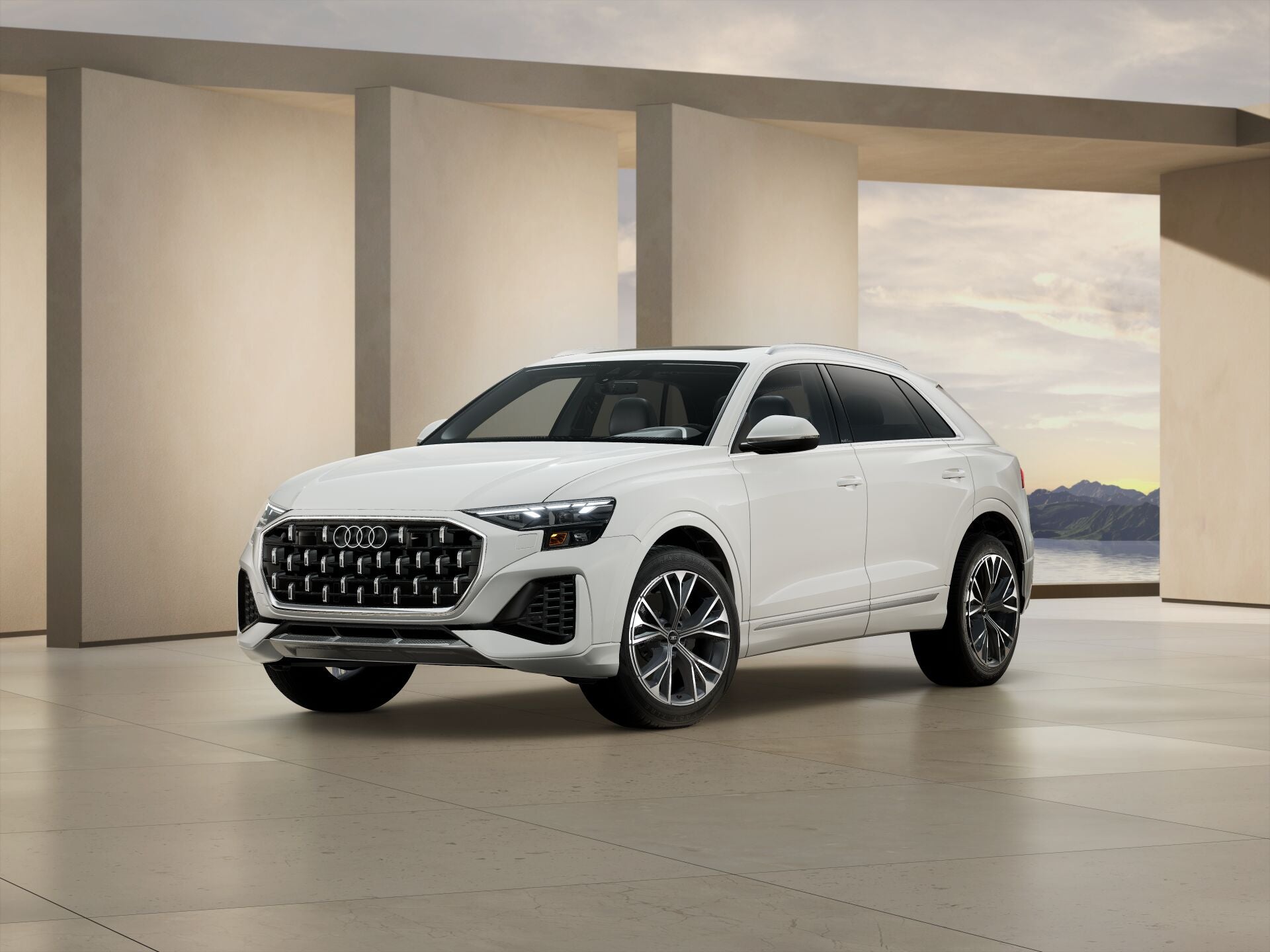 2026 Audi Q8 trim level Premium in white parked by modern structure