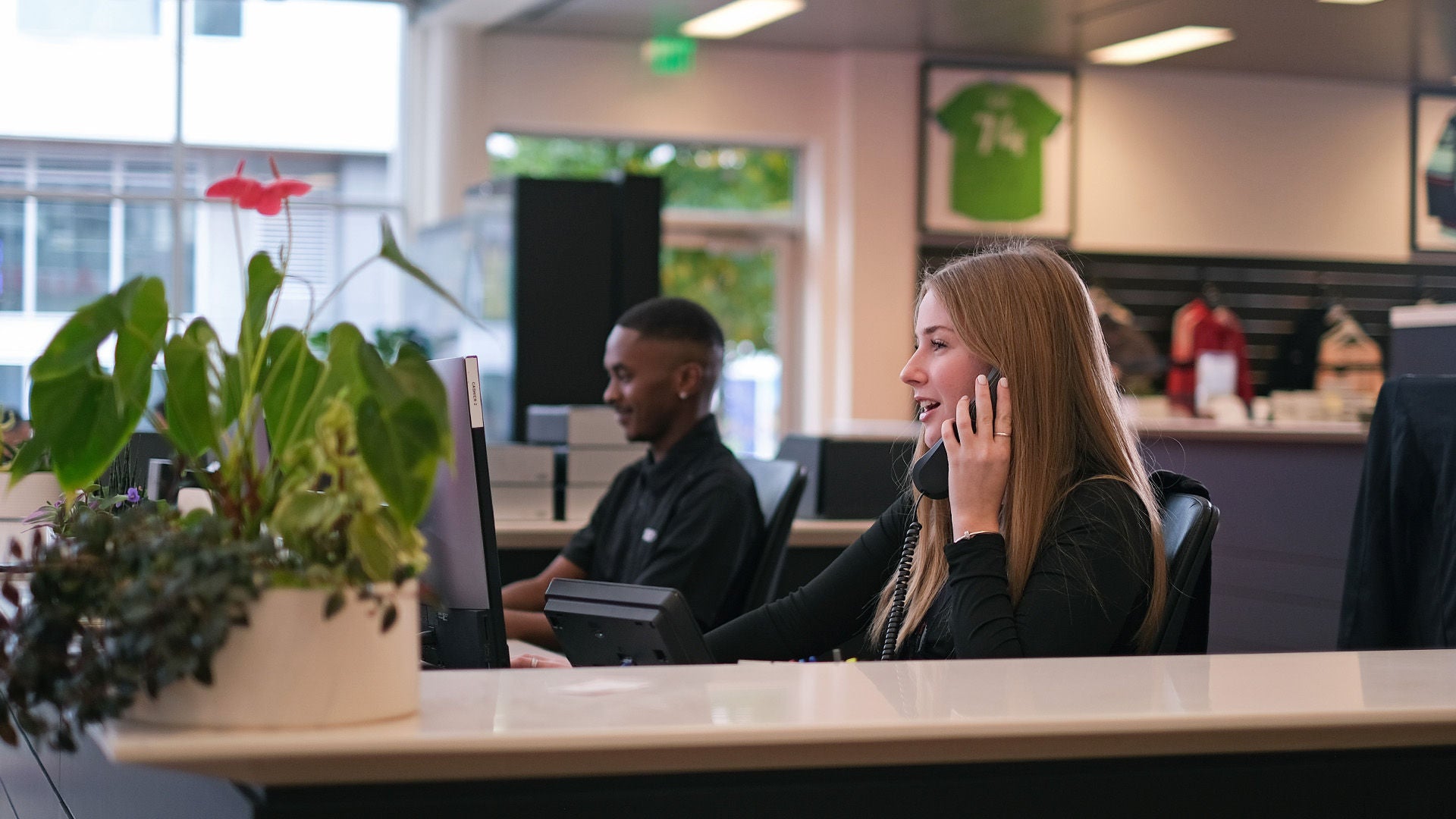 View of receptionists on phone in showroom