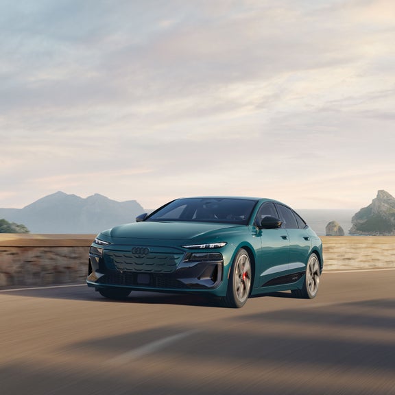 Front 3/4 view of the Audi S6 Sportback e-tron in motion. 