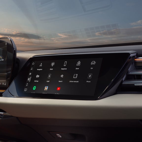 View of the interior cabin of the Audi A5, showing the passenger display screen and the dashboard.