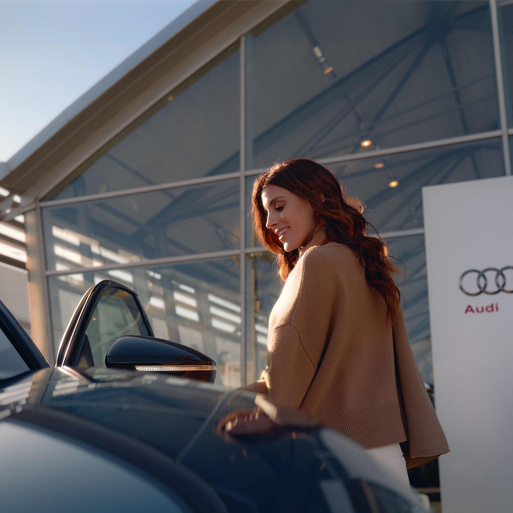 Audi Care woman walking from vehicle