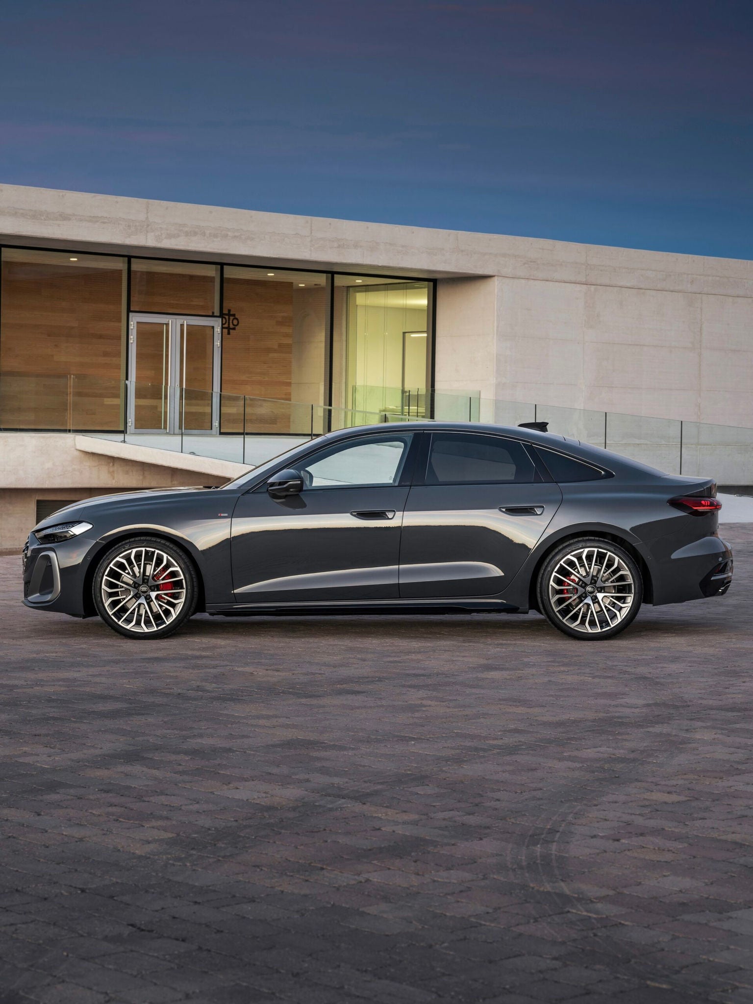 Side view of an Audi parked.