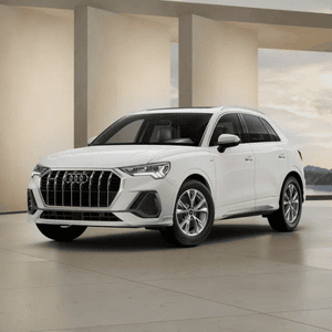 Parked Audi Q3 driver side view.