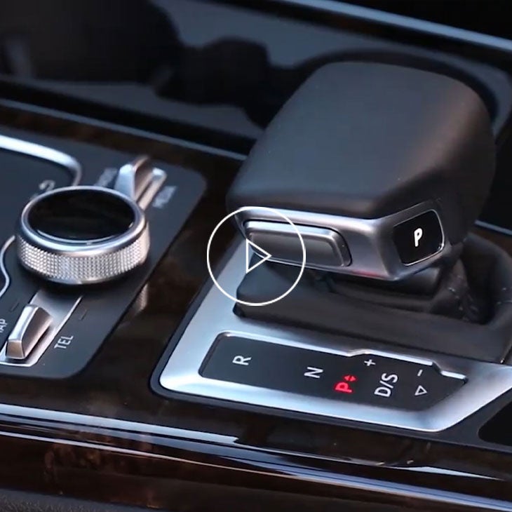 Close-up on gear box inside an Audi vehicle. 