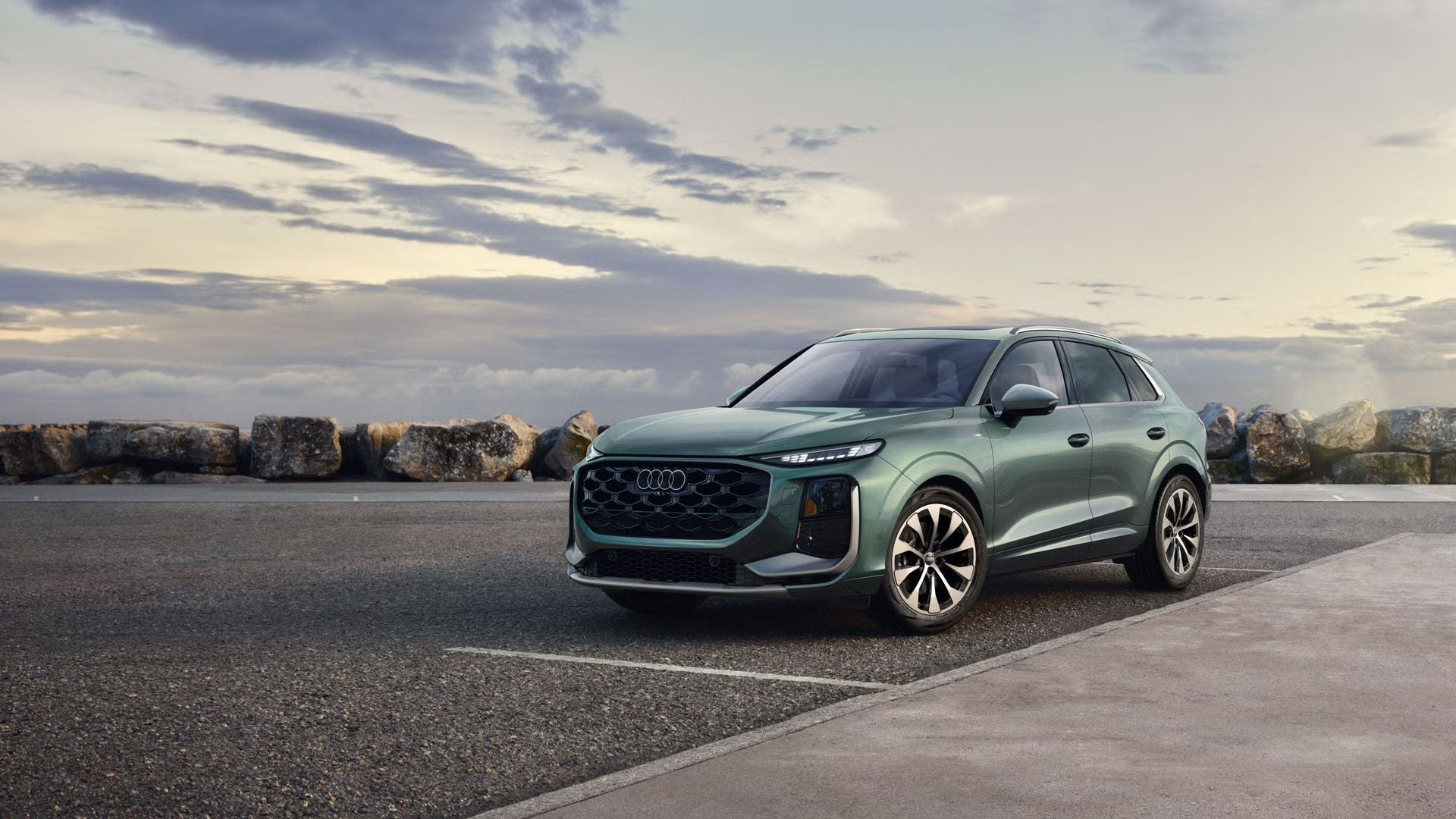 Three quarter view of an Audi Q3 SUV parked.