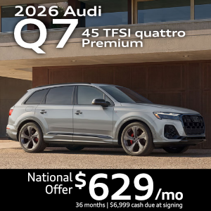 Side view of an Audi Q7 driving.
