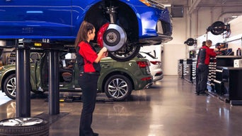 Service technician serving brakes.