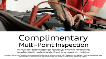 Service technician servicing vehicle. 