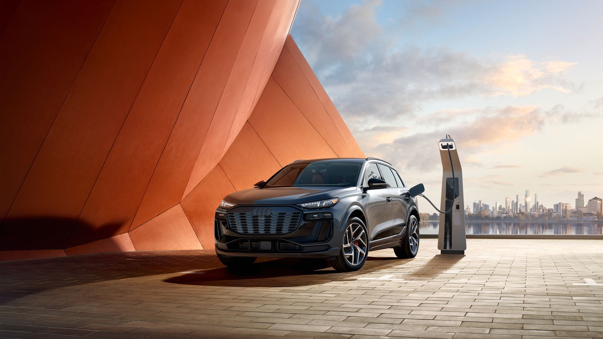 Three-quarter side view of the Audi SQ6 e-tron parked.