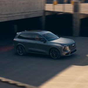 The Audi SQ7 SUV, viewed from above and from the side in an urban parking lot.