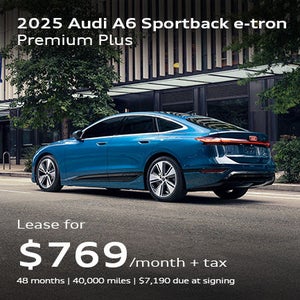 side facing 2025 Audi A6 e-tron driving