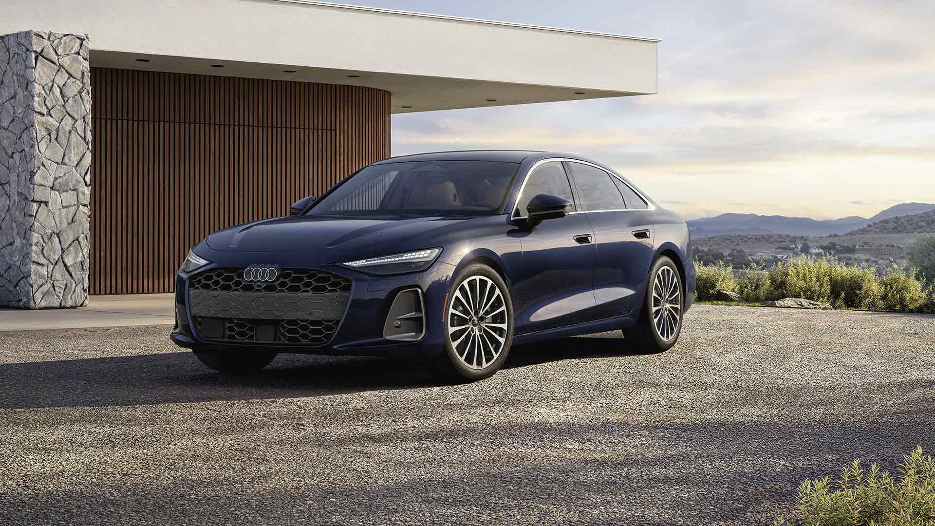 Rear profile of an Audi A5 parked. 