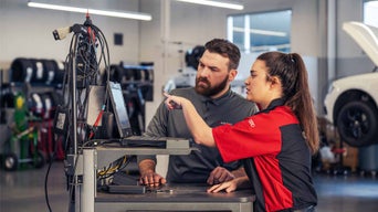 Service technician assisting customer.