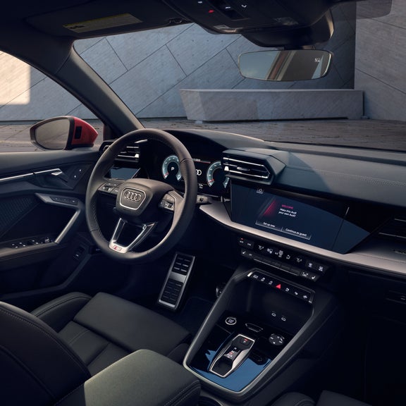 Interior view of the dashboard and front seat of the Audi A3.
