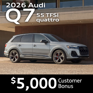 Side view of an Audi Q7 driving.