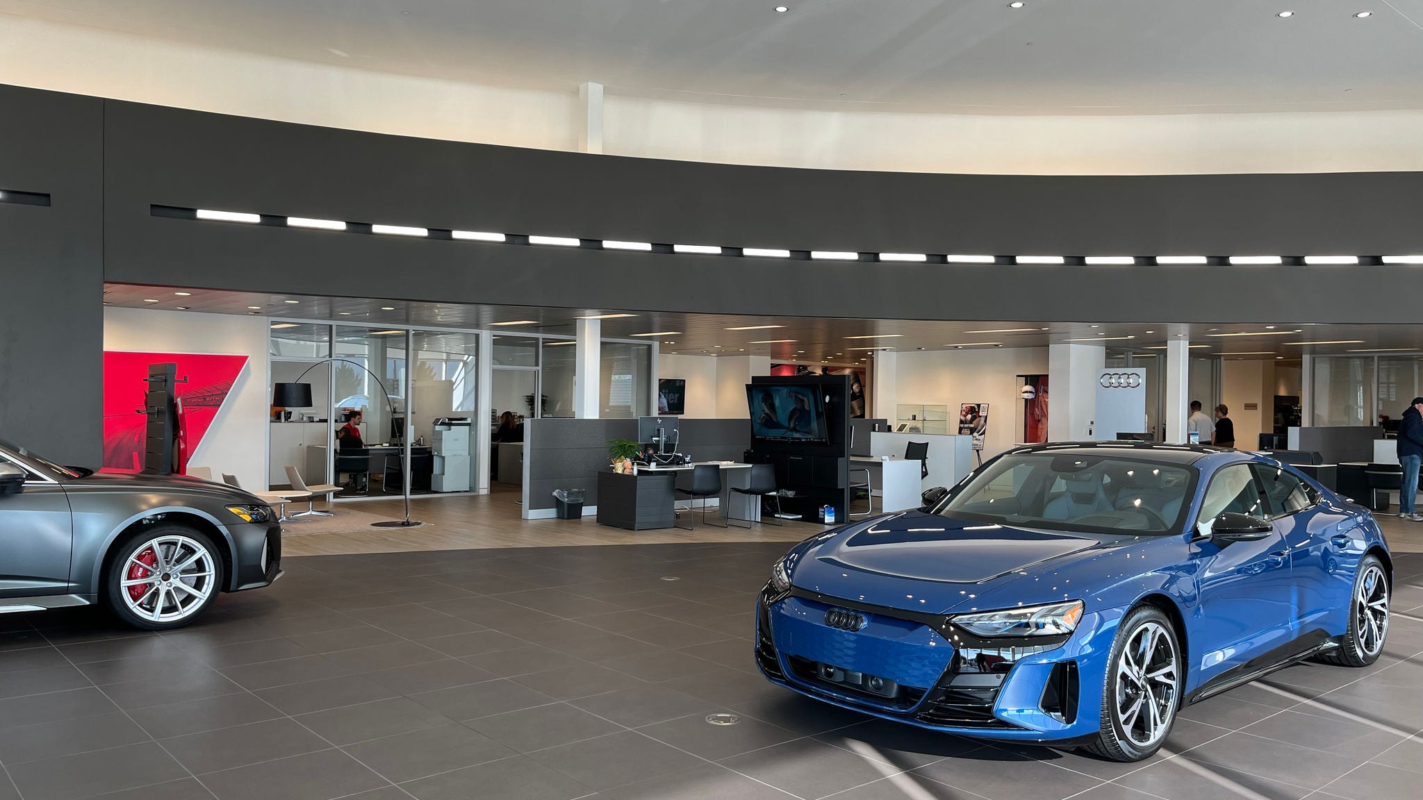 Profile view of Audi showroom.
