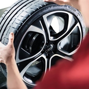 Service technician serving vehicle.