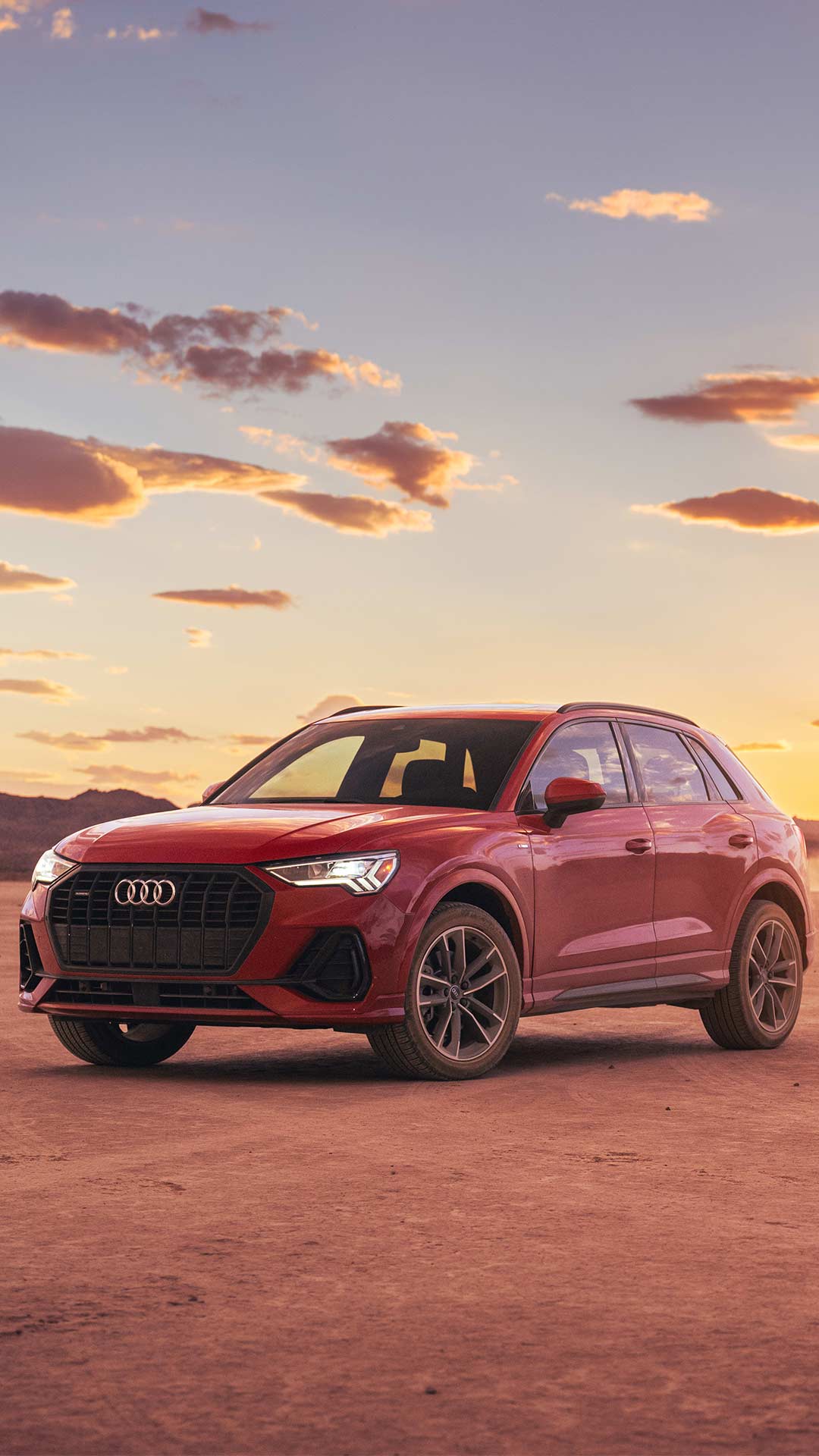 Front angle view of an Audi Q3 parked.