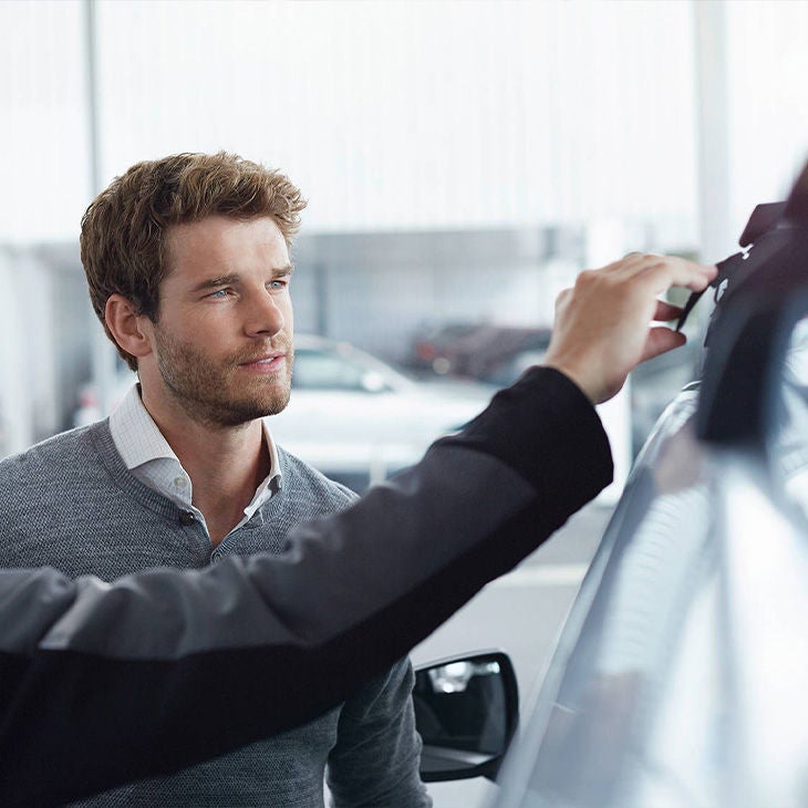 View of customer at Audi Certified pre-owned dealer.