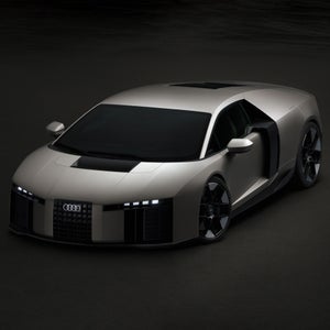 Three-quarter front view of the Audi Nuvolari in a darkened room.