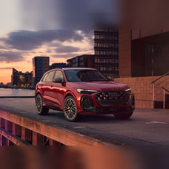 2026 Audi SQ5 parked at sunset on a waterfront pier near Audi Sewickley Pittsburgh PA