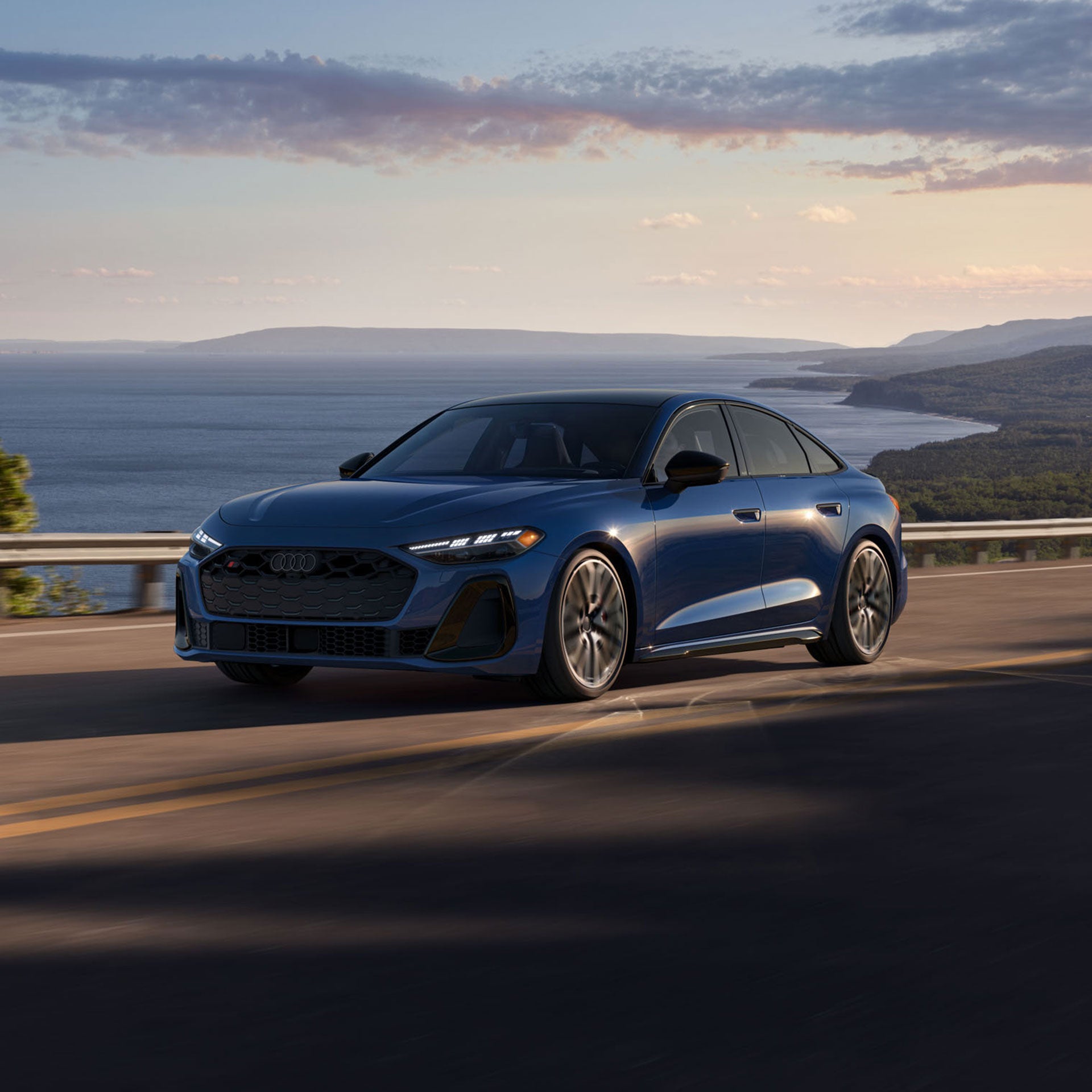 Three-quarter front view of the all-new Audi S5 in motion.
