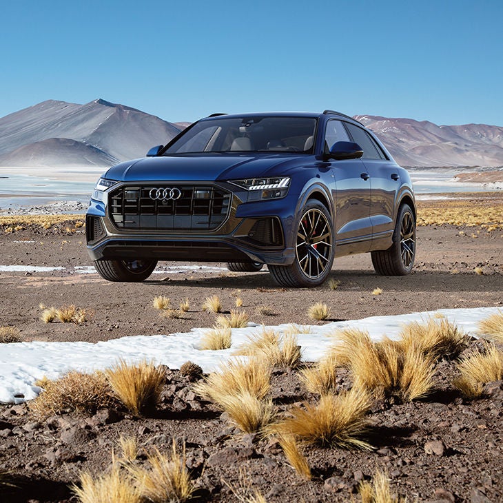 Front 3/4 view of a Blue Audi Q8.