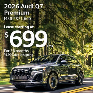 Side view of an Audi vehicle driving.