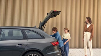 Accessing Audi accessories in the trunk.