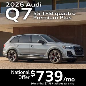 Side view of an Audi Q7 driving.
