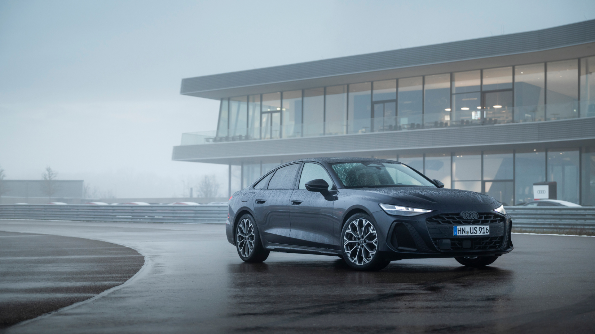 Audi outside a house in the rain
