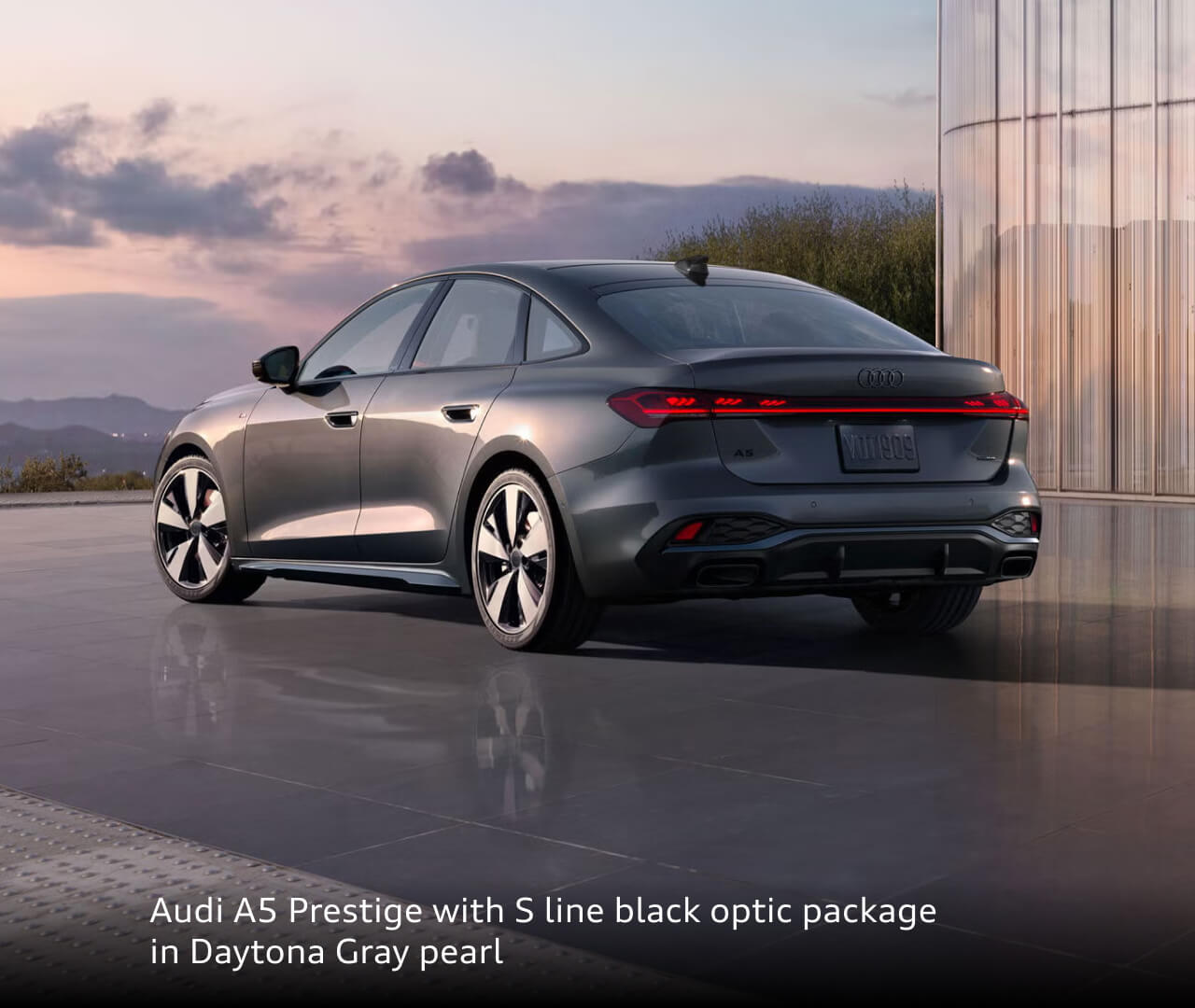 Rear three-quarter view of a 2026 Audi A5 Prestige in Daytona Gray
