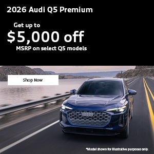Side view of an Audi Q5 driving.
