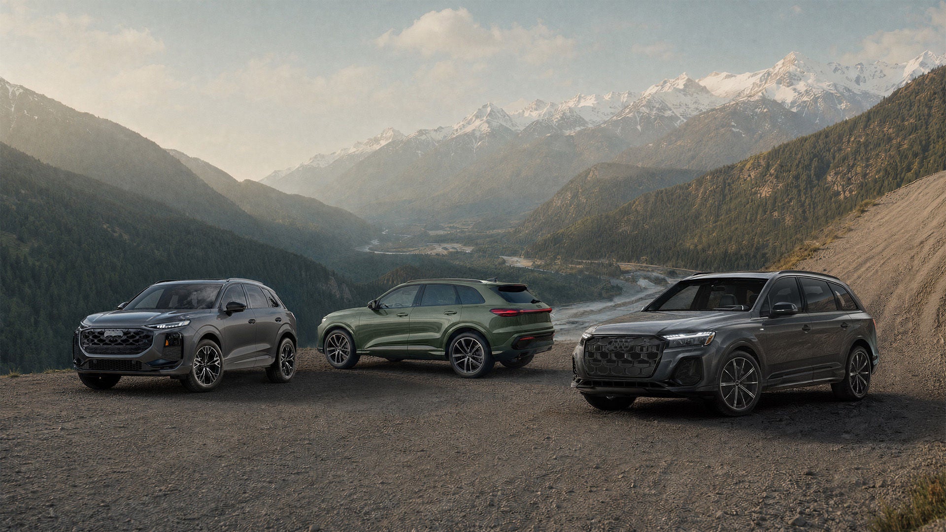 Three Audi cars in profile, side by side.