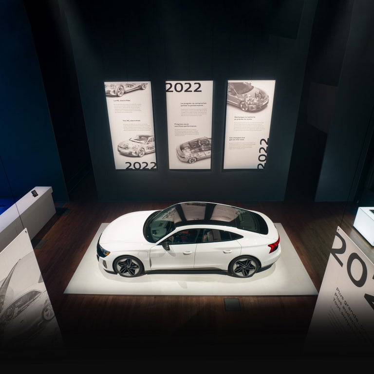 Bird's eye view of the Audi RS e-tron GT parked on an indoor stage.