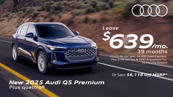 Side view of an Audi Q5 parked.