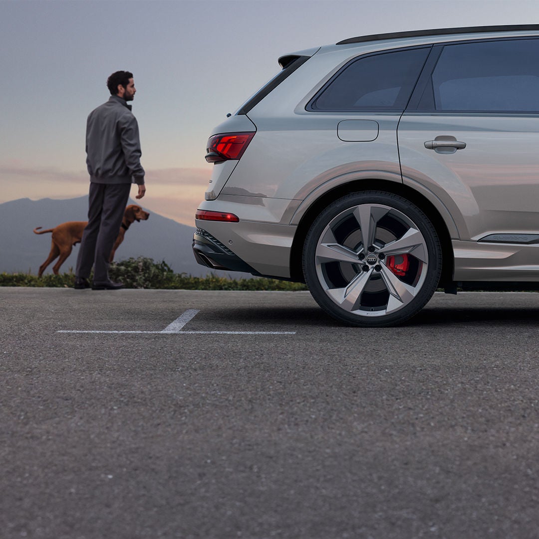 Rear profile view of an Audi Q5 parked.