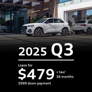 White Audi Q3 drivers side