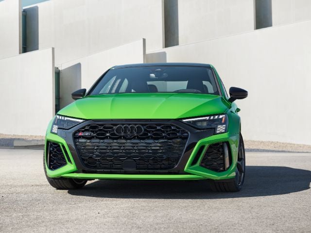 Front view of Audi RS3 with aggressive grille and LED headlights.
