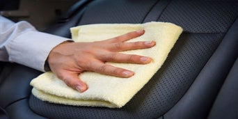 Service technician servicing tire.