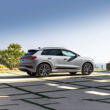 Three-quarter side profile of 2023 Audi Q4 e-tron® parked.
