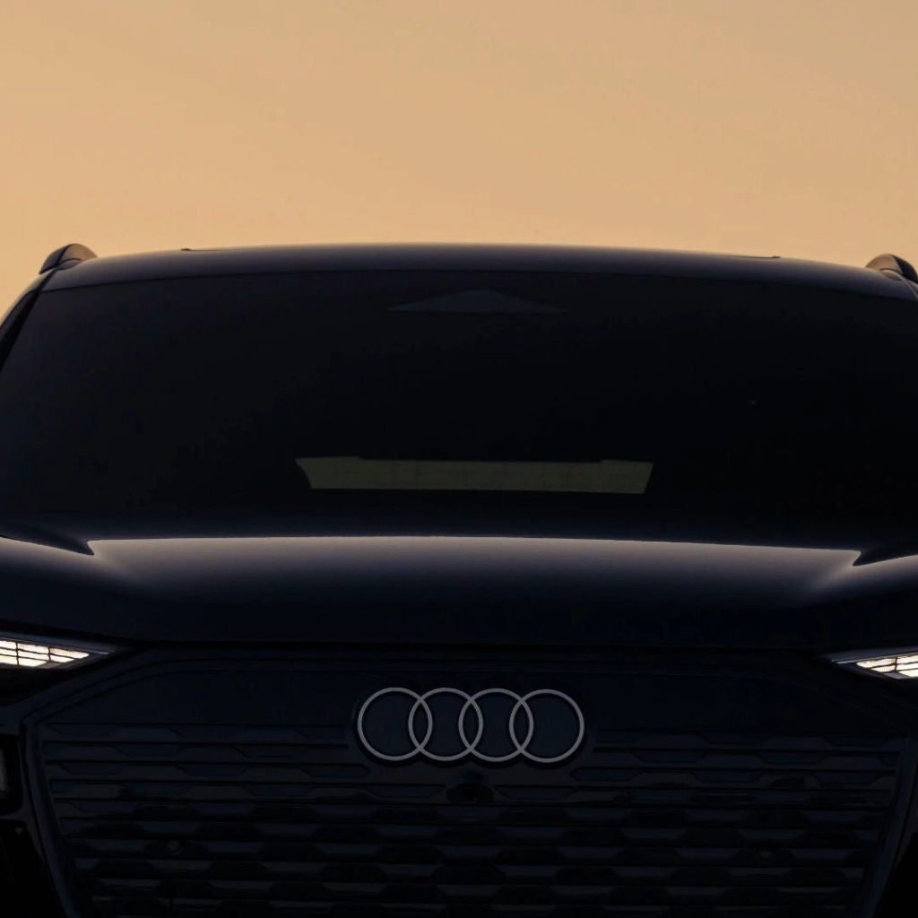 Front profile view of an Audi parked.