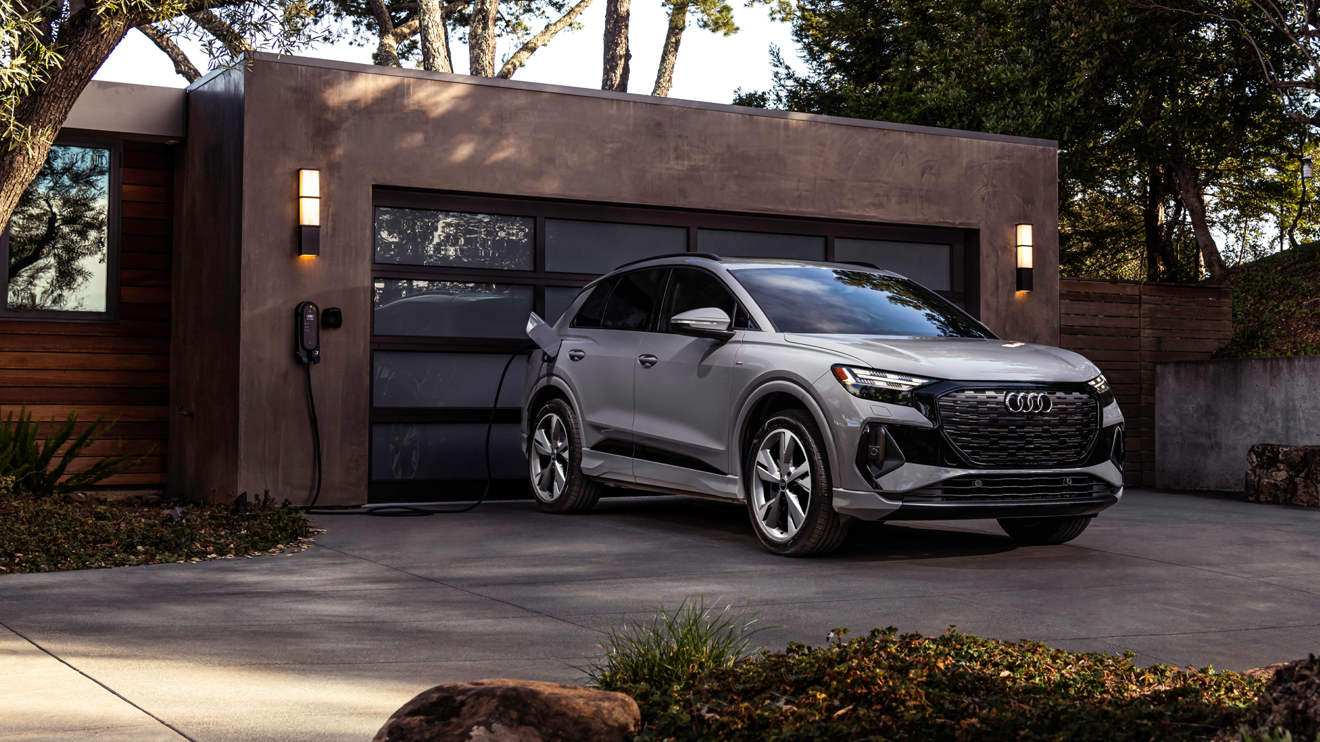 Right side profile view of an Audi Q4 etron SUV parked.